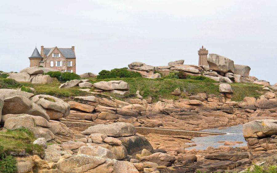 A house and a stone lighthouse in Perros-Guirec