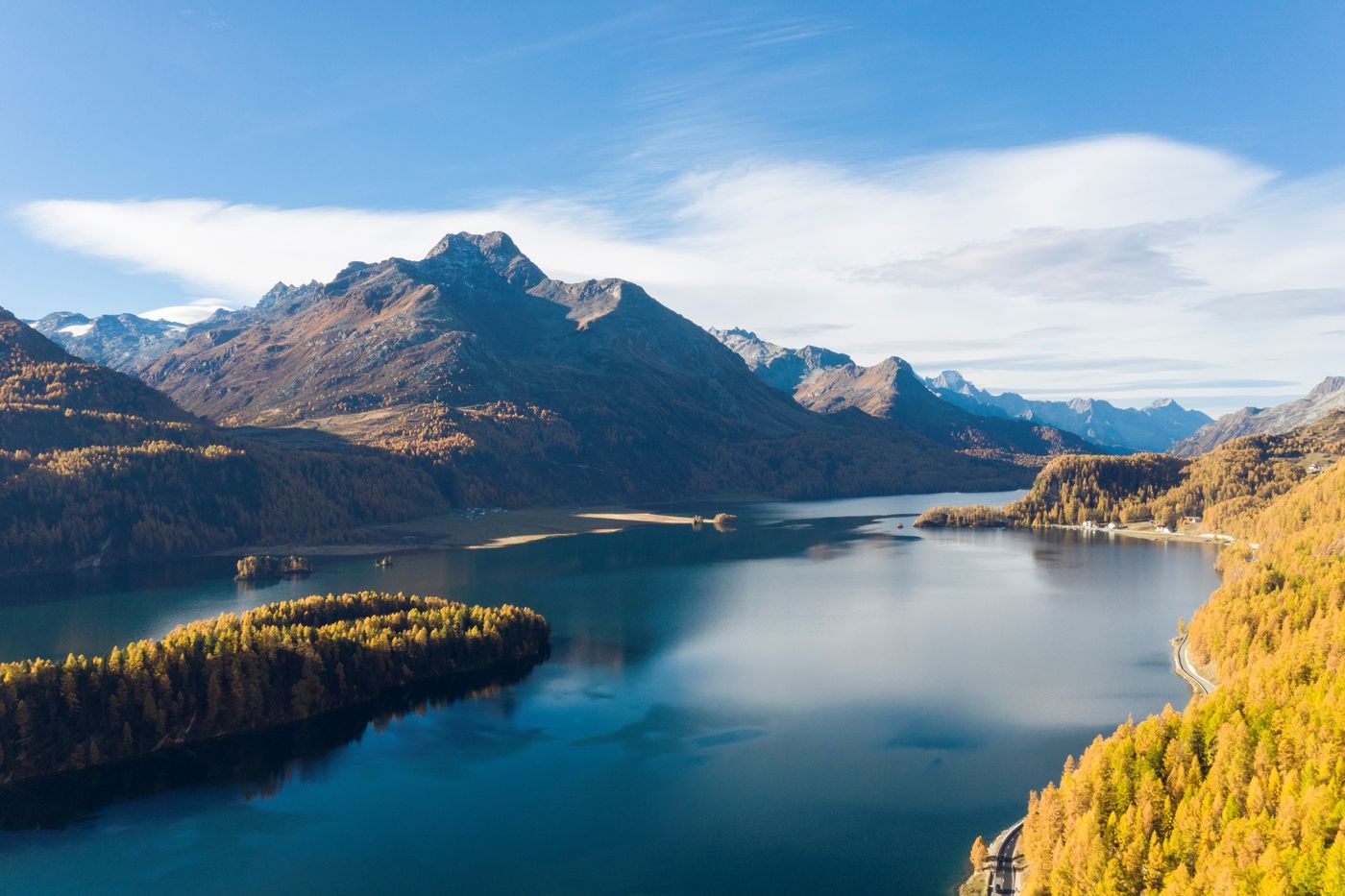 Breathtaking autumn view of Lake Sils surrounded by golden larch forests and majestic alpine peaks-supplied by Eurotrek