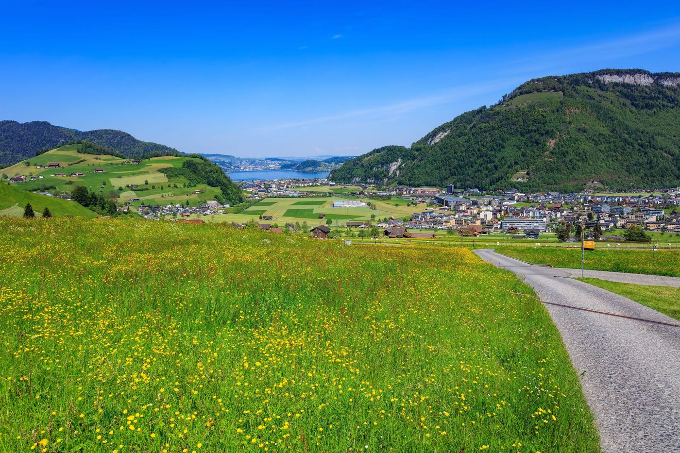 Springtime view of Stans and Lake Lucerne from the lower slopes of Mount Stanserhorn, Switzerland.
